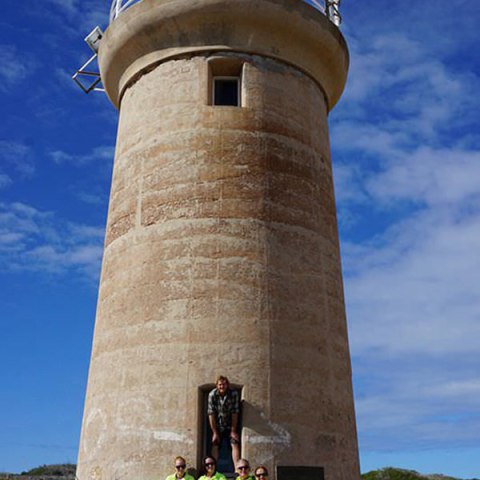 a person standing in front of a tower