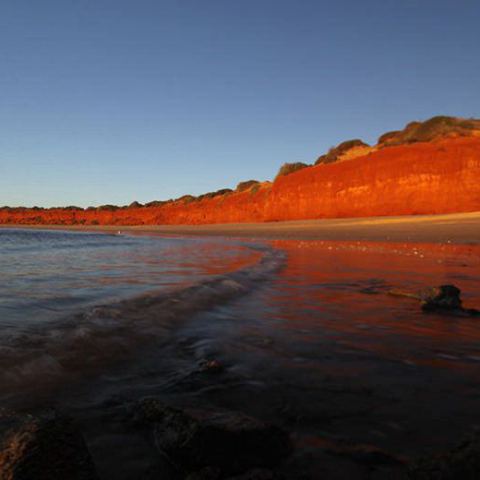 a sunset over a body of water