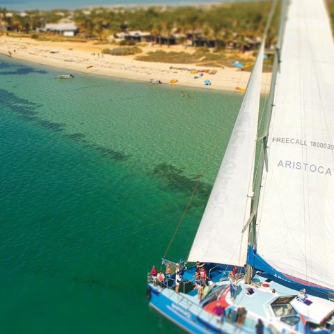 a boat sitting next to a body of water